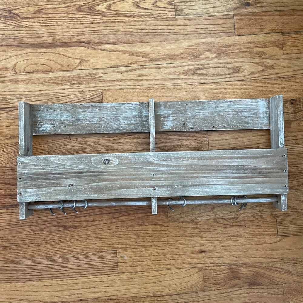 Wall mounted storage rack with hooks